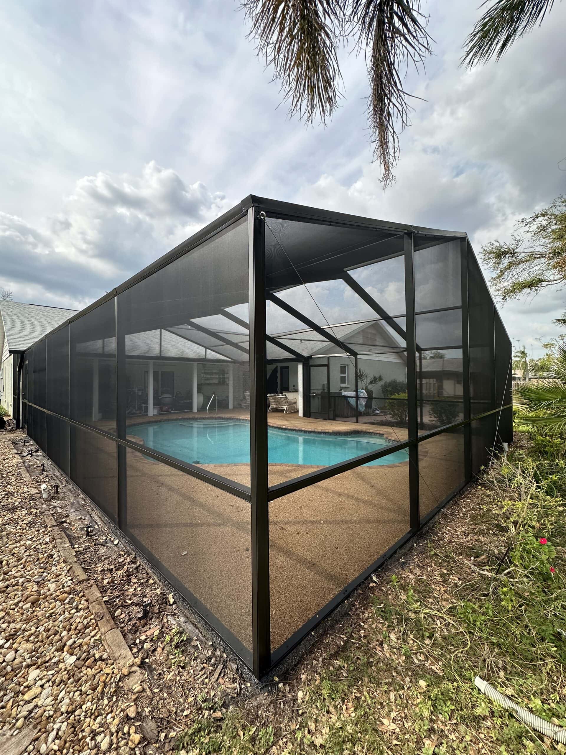 Pool cage restoration in Sarasota & Bradenton by 2H Rescreening – restored enclosure with new screens and fresh paint