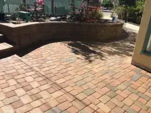 Sealed pavers on a patio in Sarasota, FL – vibrant color and surface protection after sealing by 2H Rescreening.