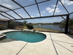 Pool cage and paver installation in Sarasota by 2H Rescreening